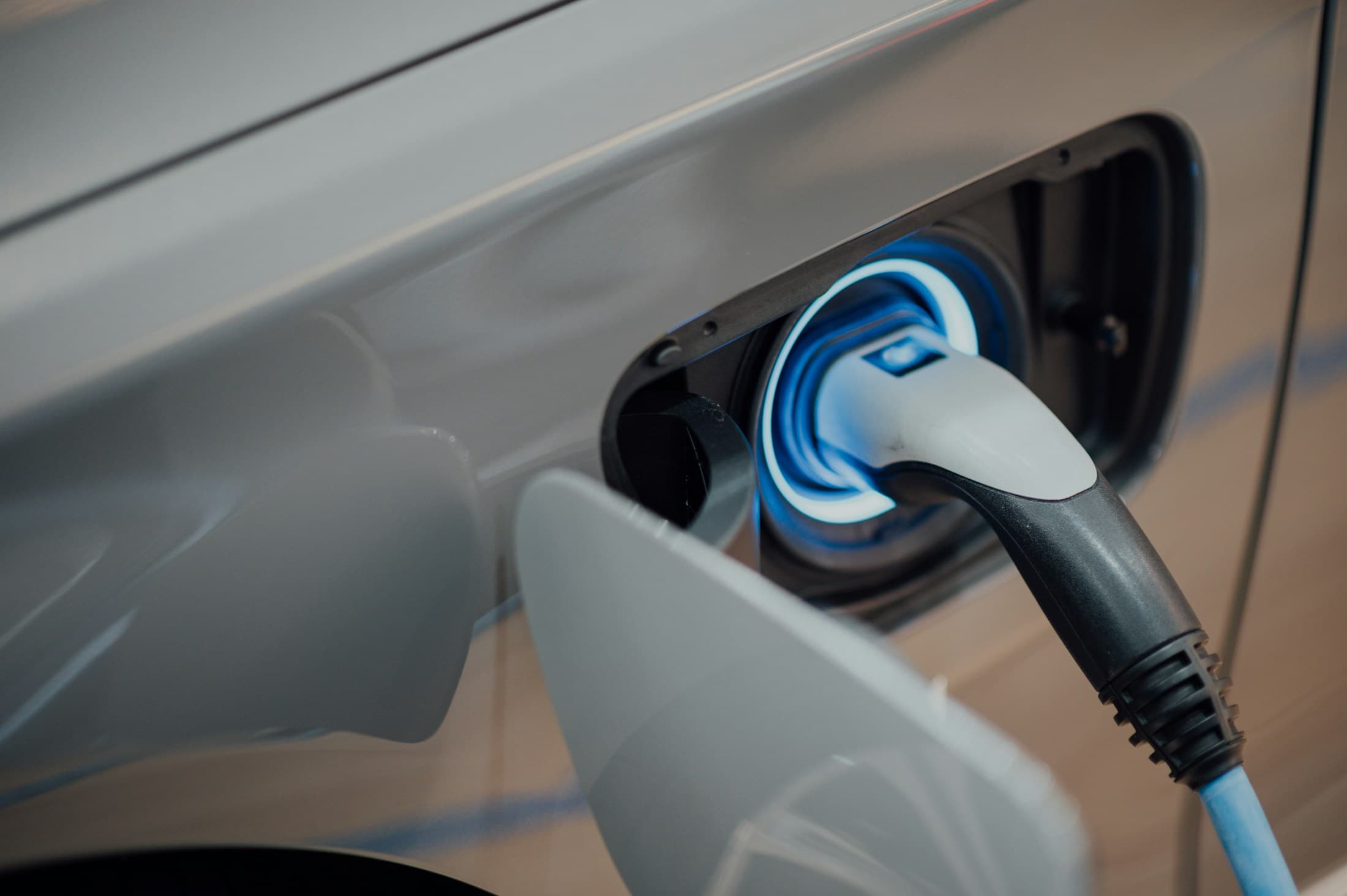 Electric vehicle plugged into a charging connector